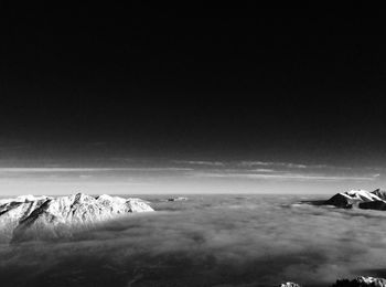 Scenic view of clouds amidst mountains