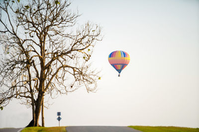 Hot air balloon flying against clear sky