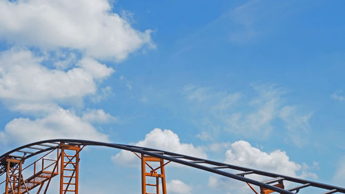 Low angle view of rollercoaster against sky