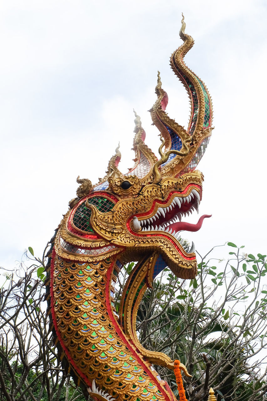 LOW ANGLE VIEW OF STATUE AGAINST SKY AT TEMPLE