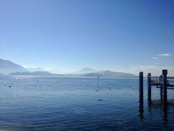 Scenic view of sea against clear blue sky