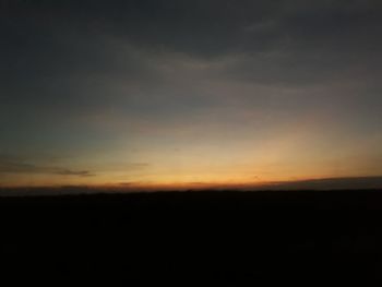 Scenic view of silhouette landscape against sky during sunset