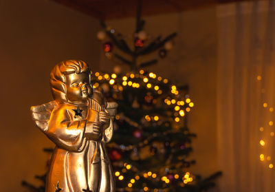 Close-up of illuminated statue at temple