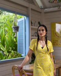 Portrait of young woman standing outdoors
