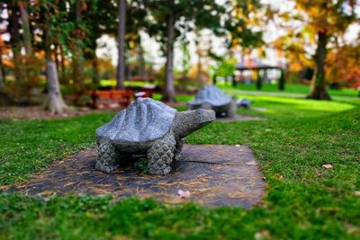 Toy sculpture on field in park