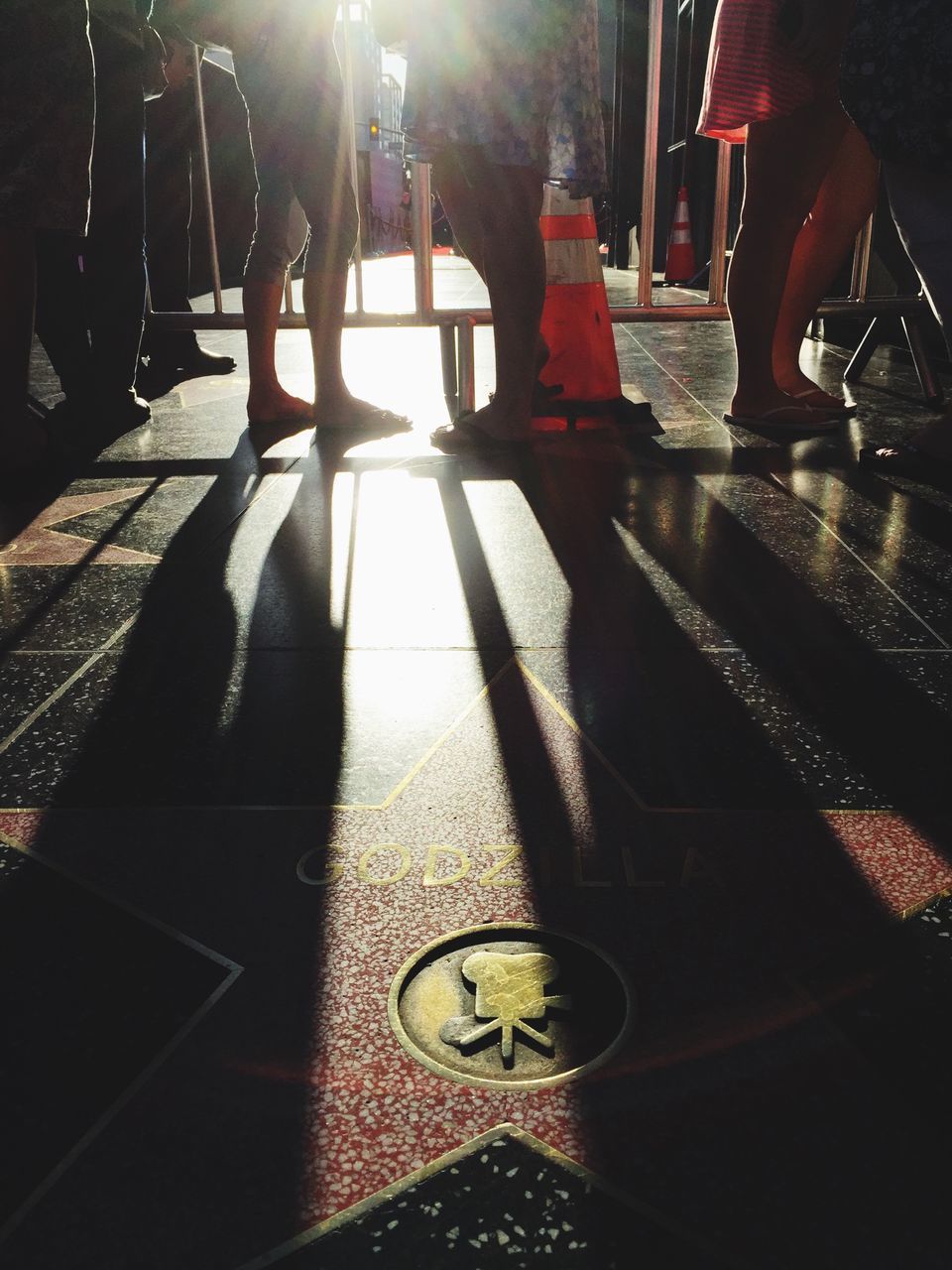 indoors, low section, illuminated, sunlight, person, flooring, sunbeam, shadow, home interior, lifestyles, tiled floor, lens flare, standing, light - natural phenomenon, men, unrecognizable person