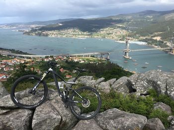 High angle view of bicycle by sea against sky