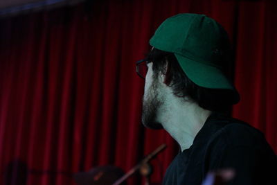 Man wearing cap indoors