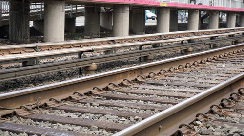 Railroad tracks by bridge