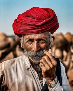 Close-up portrait of man wearing mask outdoors