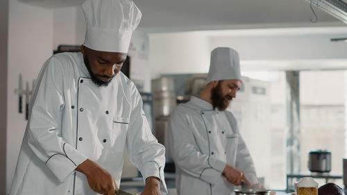Chefs working in commercial kitchen