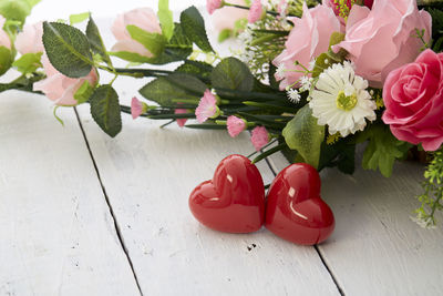 Close-up of red roses on table