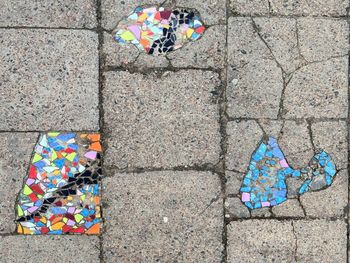 High angle view of multi colored umbrella on street