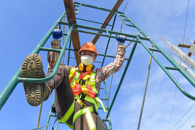 Low angle view of construction site against sky