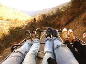 Low section of friends on vehicle roof