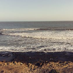 Scenic view of sea against clear sky