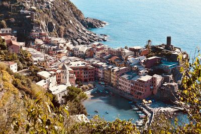 High angle view of buildings by sea