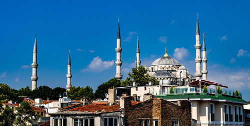 View of mosque against blue sky