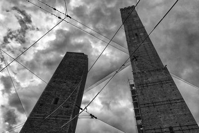 Low angle view of electricity pylon against sky