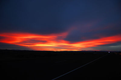 Scenic view of landscape against cloudy sky