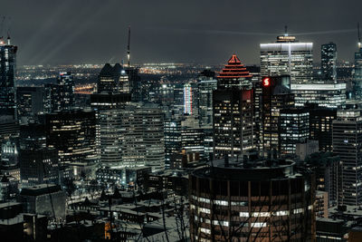 Illuminated buildings in city at night