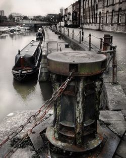 Boats moored in river