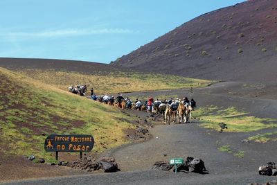 Group of people on volcanic grounds 
