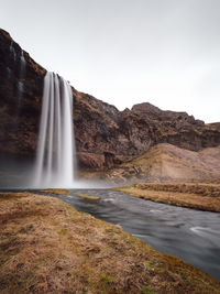 Scenic view of seljalandsfoss waterfall against clear sky