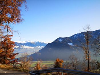 Scenic view of mountains against clear blue sky