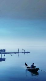 Silhouette of boats in calm sea
