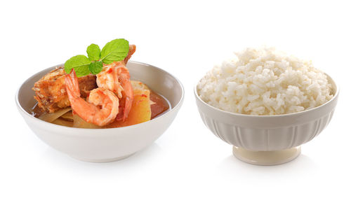Close-up of food served on table against white background