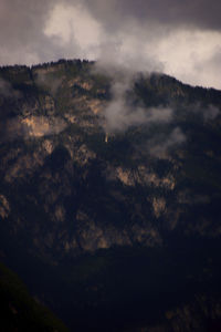 Low angle view of mountain against sky during sunset