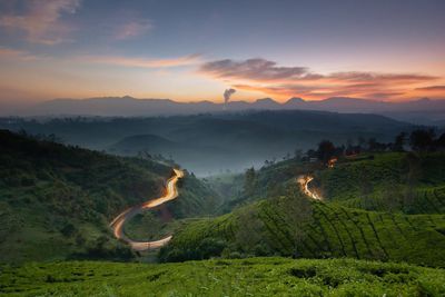 Scenic view of landscape against sky during sunrise