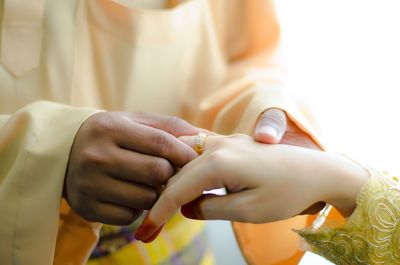 Close-up of woman holding hands