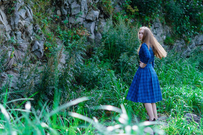 Woman standing in grass