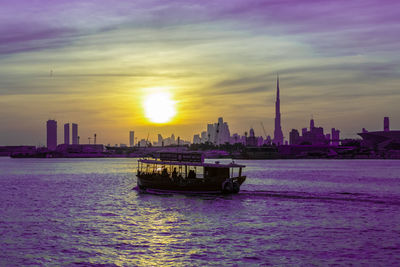 Scenic view of buildings against sky during sunset