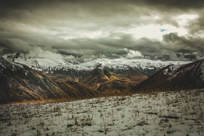 Scenic view of snowcapped mountains against sky