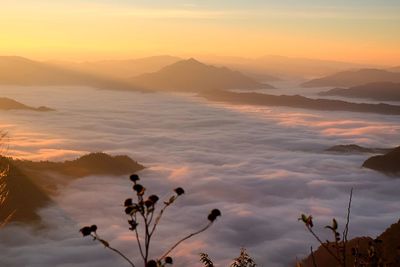 Scenic view of mountains against sky during sunset