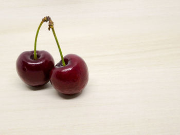 Close-up of strawberries on table against white background