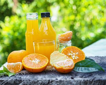 Close-up of orange juice on table