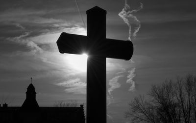 Low angle view of silhouette statue against sky during sunset