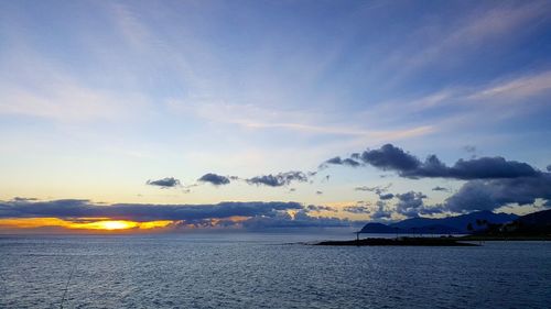 Scenic view of mountains against sky at sunset