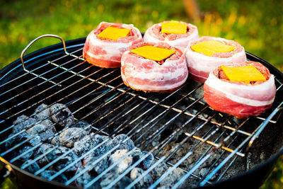 High angle view of meat on barbecue grill