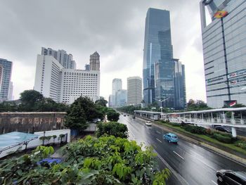 Modern buildings in city against sky