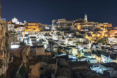 Aerial view of buildings in city at night