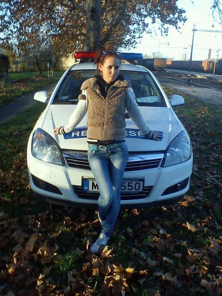 transportation, person, lifestyles, mode of transport, front view, young adult, leisure activity, casual clothing, land vehicle, full length, car, portrait, looking at camera, tree, childhood, road, standing, travel