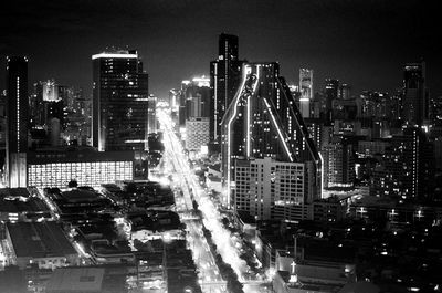 High angle view of illuminated buildings in city at night