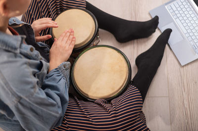 High angle view of woman sitting on stage