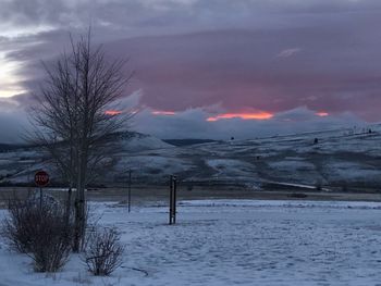 Scenic view of snow covered landscape against sky