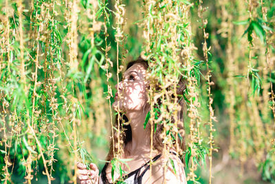 Portrait of young woman on land